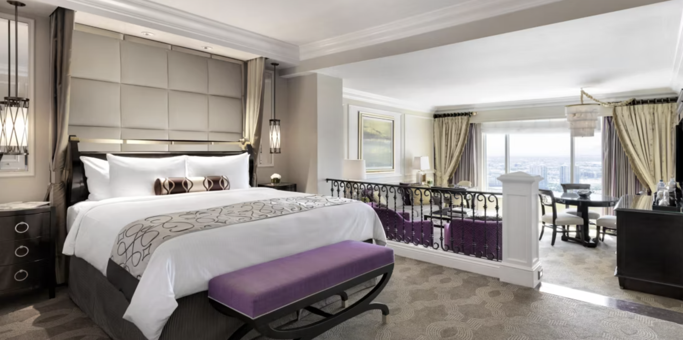 The Venetian Suite king bed featuring a living room